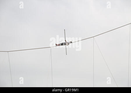 The high-wire walking performance in Urumqi. A sports performance with characteristics of minority groups in Xinjiang Uygur Autonomous Region including high-wire walking, goat fighting, chicken fighting and wrestling is held in Urumqi, capital of northwest ChinaÂ¡Â¯s Xinjiang Uygur Autonomous Region. © SIPA Asia/ZUMA Wire/Alamy Live News Stock Photo