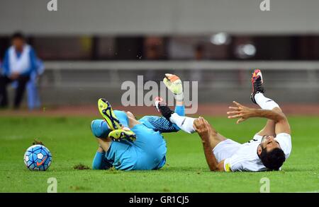 Shenyang, China's Liaoning Province. 6th Sep, 2016. China's goalkeeper Zeng Cheng (L) and Iran's Vahid Amiri fall on the ground during the Russia 2018 World Cup Asian Qualifier match between China and Iran in Shenyang, capital of northeast China's Liaoning Province, on Sept. 6, 2016. © Tao Xiyi/Xinhua/Alamy Live News Stock Photo