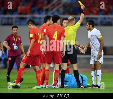 Shenyang, China's Liaoning Province. 6th Sep, 2016. Iran's Vahid Amiri (1st R) receives a yellow card after clashes with China's goalkeeper Zeng Cheng (below) during the Russia 2018 World Cup Asian Qualifier match between China and Iran in Shenyang, capital of northeast China's Liaoning Province, on Sept. 6, 2016. © Tao Xiyi/Xinhua/Alamy Live News Stock Photo