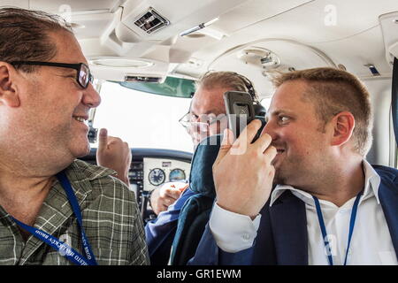 Aug 28, 2016 - Novi Sad, Serbia - Chris Principe (global banking principal on the left) VIT JEDLICKA (president of Liberland on the right) and Herve Lacorne (Founded Trade Solutions Group (TSG) in April 2000 and serves as its President and CEO) are having fun while taking off. The Free Republic of Liberland, is a self-proclaimed micronation claiming a parcel of disputed land on the western bank of the Danube river, between Croatia and Serbia. (Credit Image: © David Tesinsky via ZUMA Wire) Stock Photo