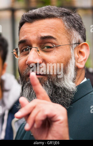 London, April 18th 2014. Anjem Choudary (pictured) and his Islam4UK group protest after Friday prayers at Regent's Park Mosque, against 'Cameron's crusades' Credit:  Paul Davey/Alamy Live News Stock Photo