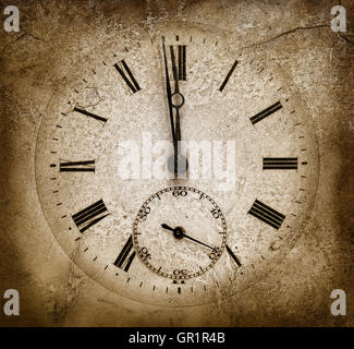 Stone clock.One minute to midnight. Cracked texture Stock Photo