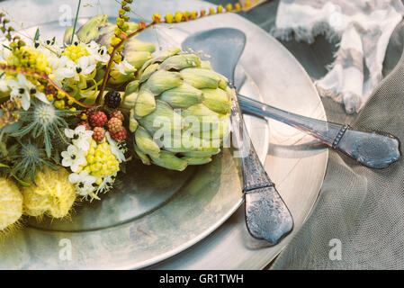 Image of rustic table setting for garden party. Vintage toned. Stock Photo