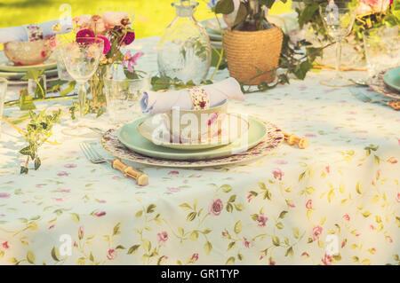 Image of a romantic table setting, for a wedding or garden party. Stock Photo