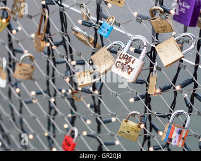 Love Locks on the bridge: Ursi + Gerry. Padlocks decorate a bridge over the Salz river.  LED bulbs also provide decoration. Stock Photo