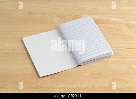 An opened blank notebook on a wood table. Stock Photo