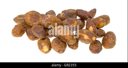 A portion of honey glazed almonds on a white background. Stock Photo