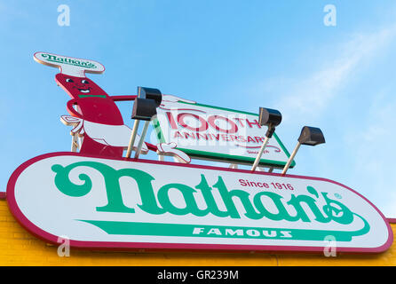 Close up of sign and building on Nathan's Famous hot dog restaurant on Coney Island boardwalk in Summer. Stock Photo