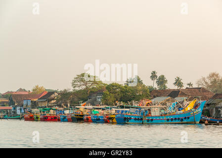 Fishing boats moored at the harbour near Fort Cochin, Kerala, India Stock Photo