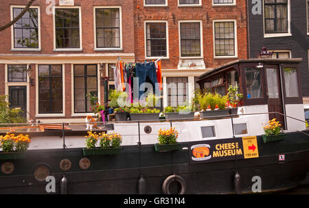 A typical sight seen on a canal cruise in Amsterdam -- Promoting the Cheese Museum Stock Photo