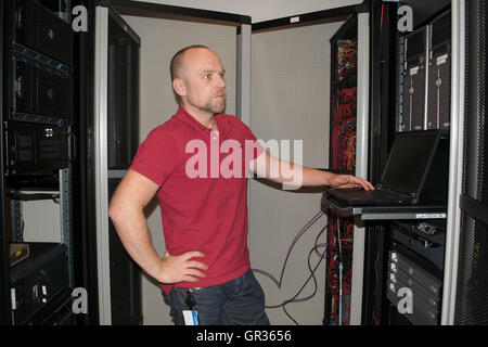 IT consultant performs work in a data center Stock Photo