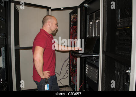 IT consultant performs work in a data center Stock Photo