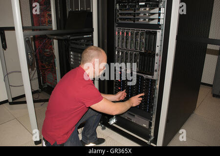 IT consultant performs work in a data center Stock Photo