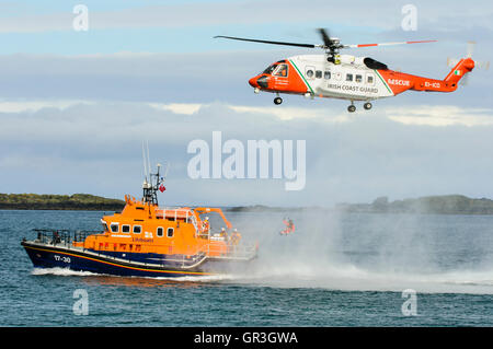 Winchman of the Sikorsky S-92 from the Irish Coastguard is winched down to the Portrush Lifeboat, RNLB William Gordon Burr Stock Photo