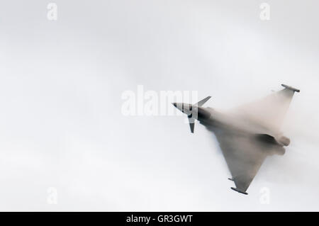 A condensation cloud forms over the wings of a Eurofighter Typhoon from the Royal Air Force