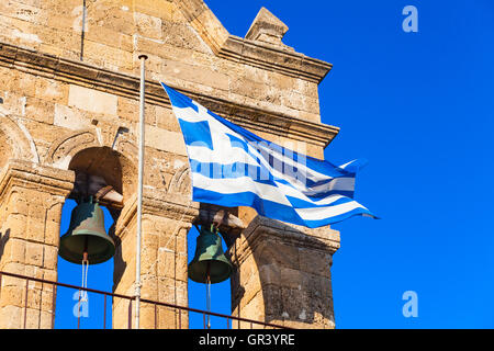 Waving Greek flag on Church of Saint Nicholas of Mole on Solomos Square. Zakynthos, Greek island in the Ionian Sea Stock Photo