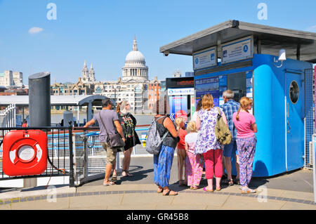 People at Bankside Pier buying tickets for boat cruises on the River Thames, London, England, UK Stock Photo