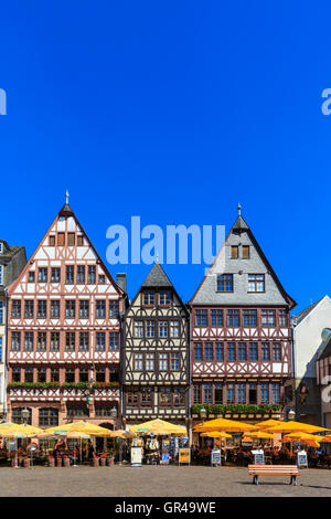 Restored medieval houses on cobblestoned Römerberg square in the historic centre of Frankfurt, Germany Stock Photo