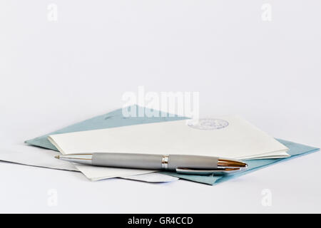 Closeup of an official document and envelope on bright background Stock Photo