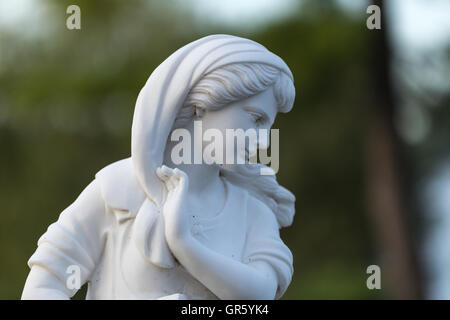 Statue of a beautiful woman in summer Stock Photo - Alamy