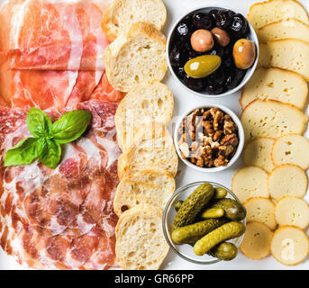 Meat and cheese snack set for wine on white background Stock Photo