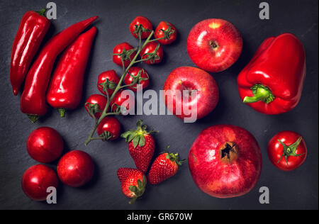 Red healphy vegetables and fruits on a black slates Stock Photo