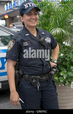 An attractive woman from the NYPD counterterrorism Bureau on patrol in Times Square in Midtown Manhattan, NYC. Stock Photo