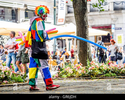 A man selling balloons on the main street in Oslo while he is dressed as a balloon Stock Photo