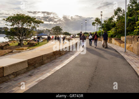 People walking along paths at Barangaroo Reserve, Sydney, New South Wales, Australia Stock Photo
