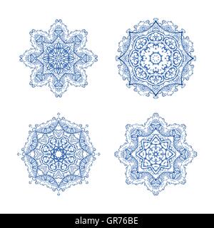 Vector set of four round snowflakes. Vector blue mandalas. ornate snowflakes. Ornament beautiful card with mandala. Stock Vector