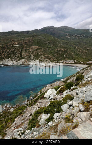 Marine De Giottani, Cap Corse, Gravel Beach At The West Coast With A Little Harbor And The Small Hotel, Corsica, France Stock Photo