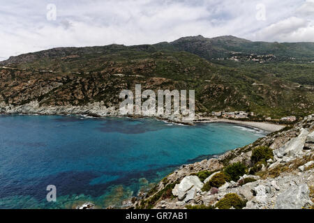 Marine De Giottani, Cap Corse, Gravel Beach At The West Coast With A Little Harbor And The Small Hotel, Corsica, France Stock Photo