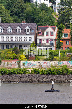 Man On Buoy Stock Photo