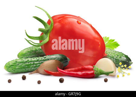 Gherkins (tiny cucumbers or cornichons) with oblong tomato for pickling or canning. Clipping path, shadow separated. Design elem Stock Photo