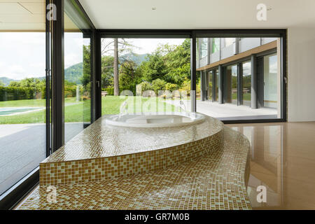 beautiful room with jacuzzi, window overlooking the garden Stock Photo