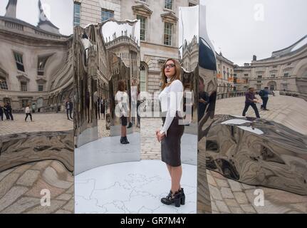 Celine Xhixha views Bliss, by Albanian artist Helidon Xhixha, at the first London Design Biennale, which takes place at Somerset House, London until 27th September. Stock Photo