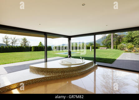 beautiful room with jacuzzi, window overlooking the garden Stock Photo