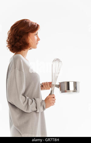 Woman With A Wire Beater Stock Photo