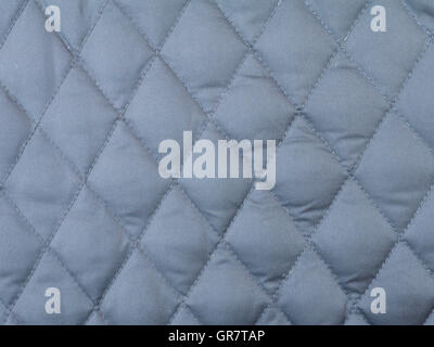 Dark grey rhombus quilted winter cloth background Stock Photo
