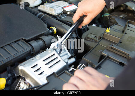 Mechanic Holding Spanner Fixing Car Engine Stock Photo