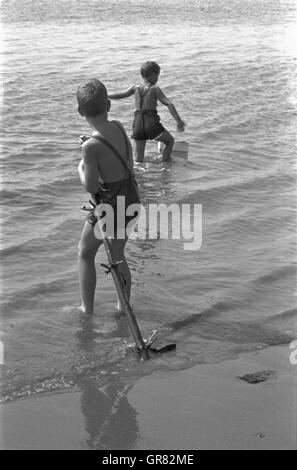Child Playing In The Sand 1970 Bw Stock Photo