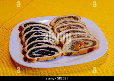 Nut Beigli Poppy Beigli Or Poppy Seed Roll With Dried Plums, An Old-Fashioned Hungarian Christmas Cookies Stock Photo