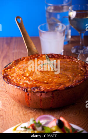 Baked Moussaka Dish On A Wooden Board Stock Photo