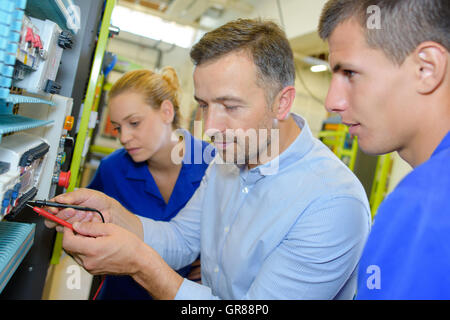 electrician testing the voltage Stock Photo