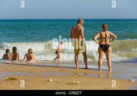 People at the famous beach of Olhos de Agua in Albufeira. This beach is a part of famous tourist region of Algarve. Portugal Stock Photo