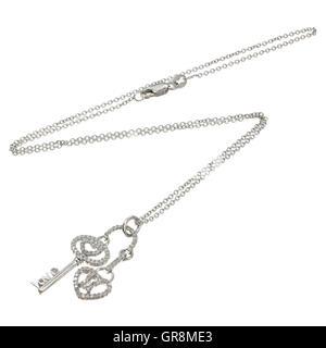 White gold chain with pendant in the shape of a key and lock Stock Photo