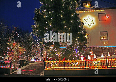 Lighted Christmas House In Coburg At Night Stock Photo