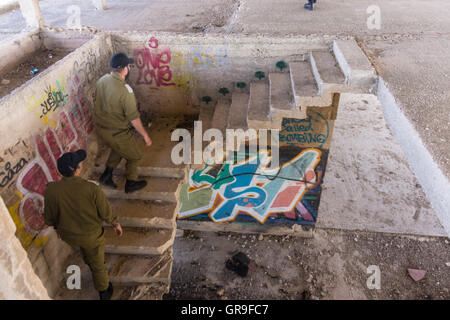 Jerusalem, Israel. Army officers go up the staircase in Jordanian king Hussein's never-completed summer resort at Tel-el-Ful Stock Photo