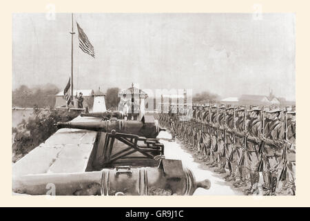 Raising the American flag over Fort Santiago, Manila, on the evening of August 13, 1898, signifying the start of the American rule in the Philippines.  After the drawing by G.W. Peters. Stock Photo