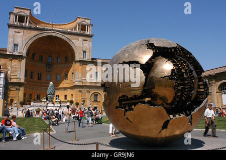 Sphere Within Sphere sculpture by Pomodoro in the Cortile della Pigna, Vatican Museum Gardens, Rome, Lazio, Italy Stock Photo